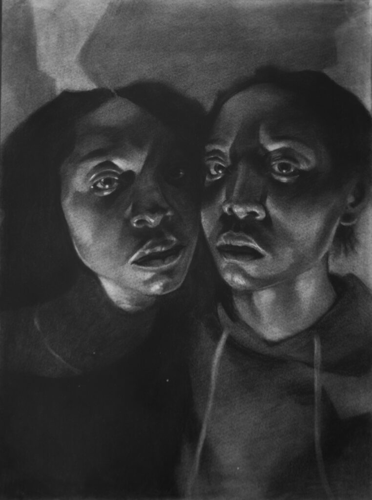Charcoal drawing of twins.