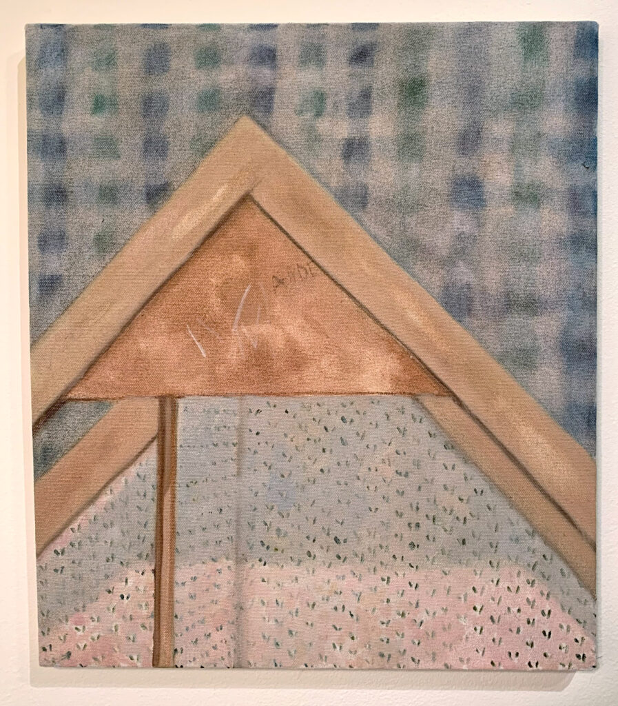 A medium-sized oil painting of the top section of a wooden dollhouse, the roof. The background is a blue-and-green faded gingham, and inside the dollhouse is a floral pink-and-blue tiny wallpaper. On the roof, there are four lightly scribbled white marks and the beginning of a capitalized name in children’s handwriting, “ANDE.”
