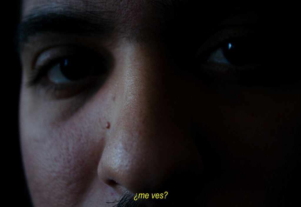 A color photo depicting an individual's eyes and nose. The lower middle portion of the image contains text.